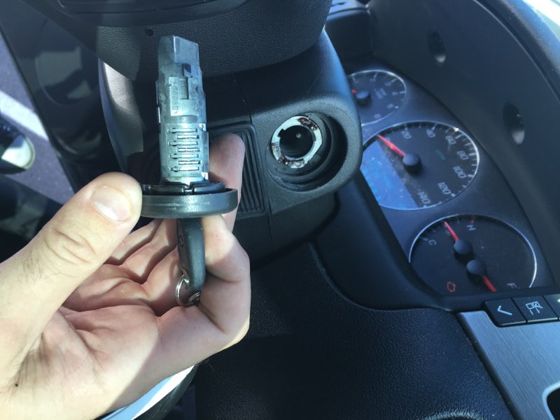 Car key ignition cylinder being rekeyed